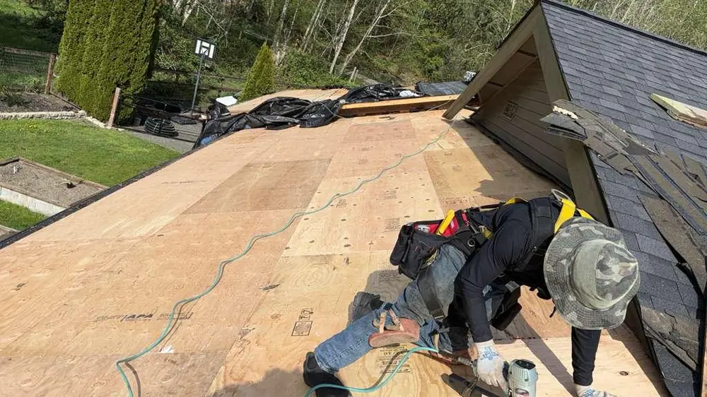 A roofing crew at work on a re-deck