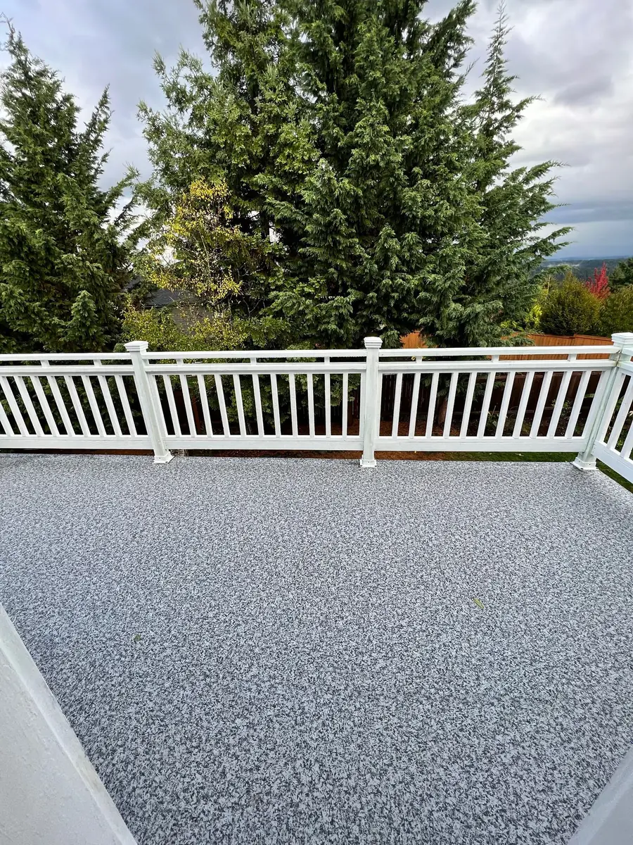 Finished deck with railing and coating